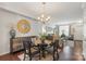 Bright dining room adjacent to the living room with chic decor at 4313 Courtly Ln, Belmont, NC 28012