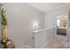 Hallway boasts modern decor, neutral walls, and leads to a bedroom, creating an inviting flow in the home at 4313 Courtly Ln, Belmont, NC 28012