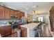Open kitchen layout with stainless steel appliances and granite counters at 4313 Courtly Ln, Belmont, NC 28012