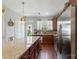 Spacious kitchen with granite countertop and stainless steel refrigerator at 4313 Courtly Ln, Belmont, NC 28012