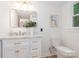 Bright bathroom with marble countertop, white vanity, gold hardware, and modern mirror at 437 Chadmore South Dr, Charlotte, NC 28270
