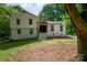 A welcoming two-story home features a painted brick foundation and well-maintained yard at 437 Chadmore South Dr, Charlotte, NC 28270