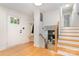 Inviting home foyer featuring a staircase, a coat rack bench and a bright, open entryway at 437 Chadmore South Dr, Charlotte, NC 28270