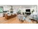 Bright open-concept living space with a kitchen island, dining area, and living room with stylish furnishings at 437 Chadmore South Dr, Charlotte, NC 28270