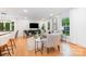 Inviting living room featuring contemporary decor, large windows, and sleek hardwood flooring at 437 Chadmore South Dr, Charlotte, NC 28270