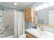 Cozy bathroom with a shower and tub combo and a wooden vanity with ample storage space at 4424 Huntington Dr, Gastonia, NC 28056