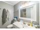 Neutral bathroom with a white vanity, updated fixtures, a shower and tub combo, and a large mirror at 4424 Huntington Dr, Gastonia, NC 28056