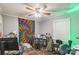 Bedroom features a ceiling fan, window with blinds, and a fun tapestry wall hanging at 4424 Huntington Dr, Gastonia, NC 28056