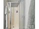 Enclosed shower with a shower door and a towel rack. A bottle of body wash is visible at 4424 Huntington Dr, Gastonia, NC 28056