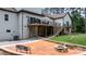 Inviting backyard deck with a fire pit and seating area, perfect for outdoor entertaining and relaxation at 4616 Gold Finch Dr, Denver, NC 28037