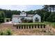 Expansive backyard with multi-level deck, lush lawn, and mature trees, perfect for entertaining at 4616 Gold Finch Dr, Denver, NC 28037