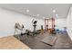 Finished basement area featuring workout equipment, providing a private gym space at 4616 Gold Finch Dr, Denver, NC 28037