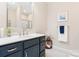Modern bathroom with a stylish vanity, marble floors, and elegant fixtures at 4616 Gold Finch Dr, Denver, NC 28037
