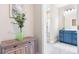 Chic bathroom featuring a blue vanity, glass-enclosed shower, and modern design at 4616 Gold Finch Dr, Denver, NC 28037