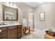 Bathroom featuring vanity with neutral countertops, and a tiled walk-in shower at 4616 Gold Finch Dr, Denver, NC 28037
