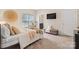 Cozy bedroom with neutral decor, plush bedding, and soft natural light at 4616 Gold Finch Dr, Denver, NC 28037