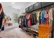 Walk-in closet featuring custom storage, shelving, and rack space for organization at 4616 Gold Finch Dr, Denver, NC 28037