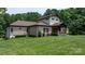 Charming brick home featuring well-maintained landscaping and a welcoming front porch at 4616 Gold Finch Dr, Denver, NC 28037