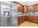 Well-equipped kitchen with stainless steel refrigerator and warm wood cabinetry at 4616 Gold Finch Dr, Denver, NC 28037