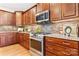 Bright kitchen features wood cabinets, granite countertops, and a stainless steel range at 4616 Gold Finch Dr, Denver, NC 28037
