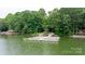 Beautiful lake view with a wooden dock and gazebo, ideal for waterfront living at 4616 Gold Finch Dr, Denver, NC 28037