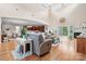 Bright and airy living room featuring fireplace and open to dining room and kitchen at 4616 Gold Finch Dr, Denver, NC 28037