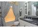 Charming bathroom with a shower-tub combo, granite vanity, and decorative shelving at 464 Granite Lake Ct, Denver, NC 28037
