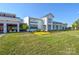 Exterior of the community clubhouse with manicured lawn and beautiful landscaping at 464 Granite Lake Ct, Denver, NC 28037