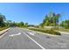 Community entrance road with well-maintained landscaping and the community name on a rock at 464 Granite Lake Ct, Denver, NC 28037