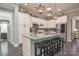 Modern kitchen featuring a spacious island with seating and stainless steel appliances at 464 Granite Lake Ct, Denver, NC 28037