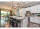 Gourmet kitchen with stainless steel appliances and a large island with barstool seating at 464 Granite Lake Ct, Denver, NC 28037