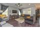 Comfortable living room with a ceiling fan, TV, and decorative accents at 464 Granite Lake Ct, Denver, NC 28037