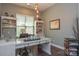 Well-lit office with custom shelves and a comfortable workspace at 464 Granite Lake Ct, Denver, NC 28037