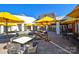 Stylish outdoor seating area with tables and umbrellas; a perfect place to relax at 464 Granite Lake Ct, Denver, NC 28037