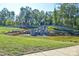 Beautiful pond with a waterfall feature in a lush green community area at 464 Granite Lake Ct, Denver, NC 28037