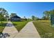 Scenic walking path leading to a building with well-maintained green space at 464 Granite Lake Ct, Denver, NC 28037