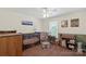 Charming Bedroom with neutral paint, ceiling fan, and views to the exterior at 4916 Ritchie Rd, Lincolnton, NC 28092