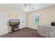 Cozy bedroom features neutral paint, ceiling fan, carpet, and window for great natural light at 4916 Ritchie Rd, Lincolnton, NC 28092