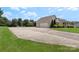 Wide driveway leads to a two-car garage, framed by mature trees and manicured landscaping at 4916 Ritchie Rd, Lincolnton, NC 28092