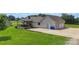 Charming home boasts an attached two-car garage, and a large, green lawn at 4916 Ritchie Rd, Lincolnton, NC 28092