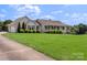 Charming single-story home with a welcoming front porch, lush lawn, and manicured shrubs at 4916 Ritchie Rd, Lincolnton, NC 28092