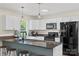 Bright kitchen featuring modern appliances, ample counter space, and eat-in bar seating at 4916 Ritchie Rd, Lincolnton, NC 28092