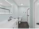 Beautiful main bath featuring modern vanity, framed mirror, and glass enclosed shower at 4916 Ritchie Rd, Lincolnton, NC 28092