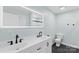 Main bath featuring a double sink vanity, framed mirror, and modern fixtures at 4916 Ritchie Rd, Lincolnton, NC 28092