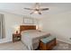 Cozy main bedroom featuring hardwood floors, a ceiling fan, and natural light at 4916 Ritchie Rd, Lincolnton, NC 28092