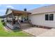 Covered patio with outdoor seating, a grill and a large, landscaped backyard at 4916 Ritchie Rd, Lincolnton, NC 28092