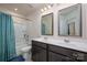 Bathroom featuring a double sink vanity, mirror, and a shower-tub combo with shower curtain at 5014 Forest Hills Pl, Fort Mill, SC 29707