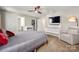 Spacious bedroom with a queen bed, crib, relaxing chair, and a walk-in closet, designed for comfort at 5014 Forest Hills Pl, Fort Mill, SC 29707