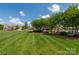 Lush community grounds featuring a well-manicured lawn, trees, and bench seating at 5014 Forest Hills Pl, Fort Mill, SC 29707