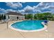 Community pool offers a swimming area and lounge seating, and a bathhouse with tables at 5014 Forest Hills Pl, Fort Mill, SC 29707
